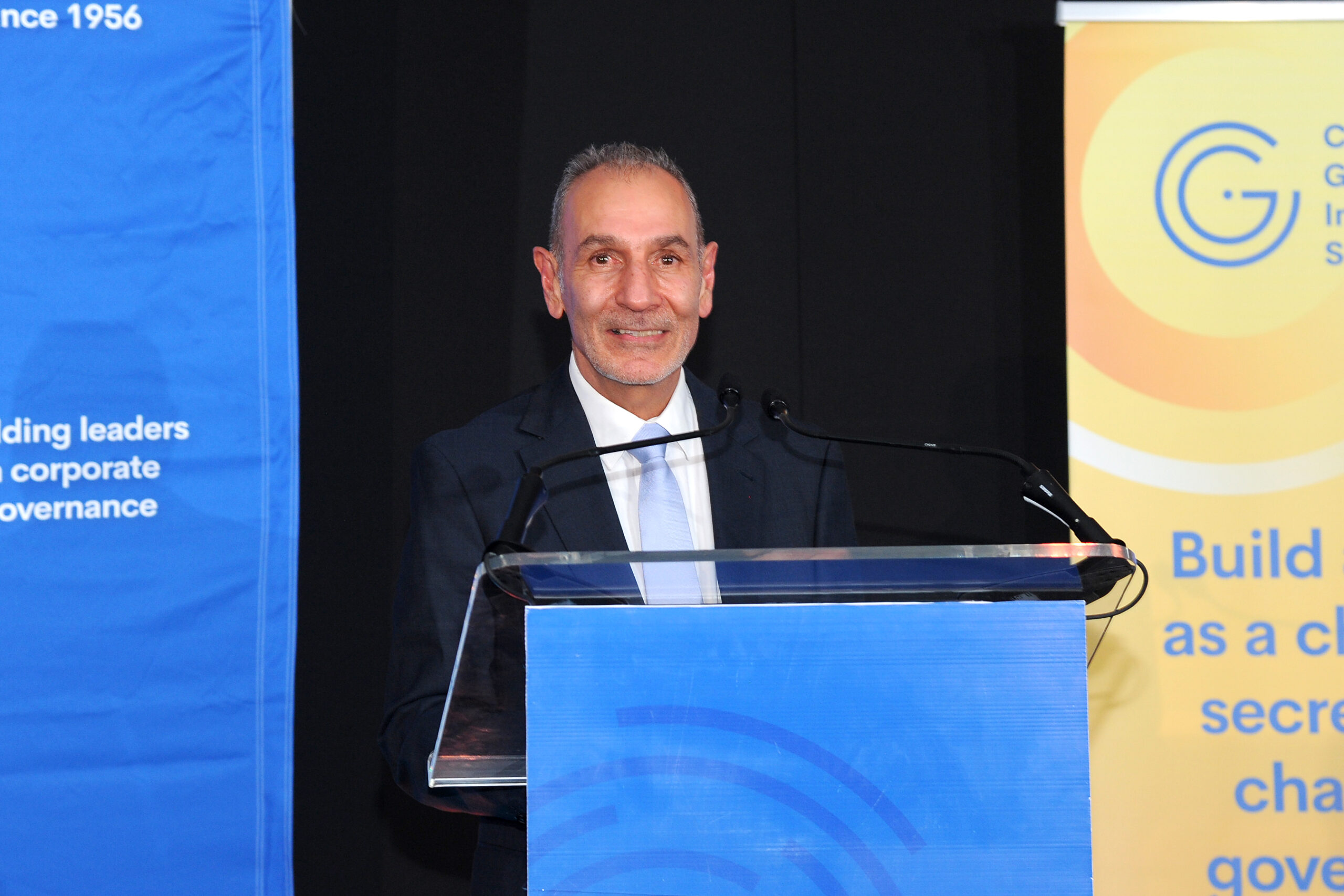 A poised moment at the podium: CGISA CEO, Stephen Sadie, announces the 2025 winners